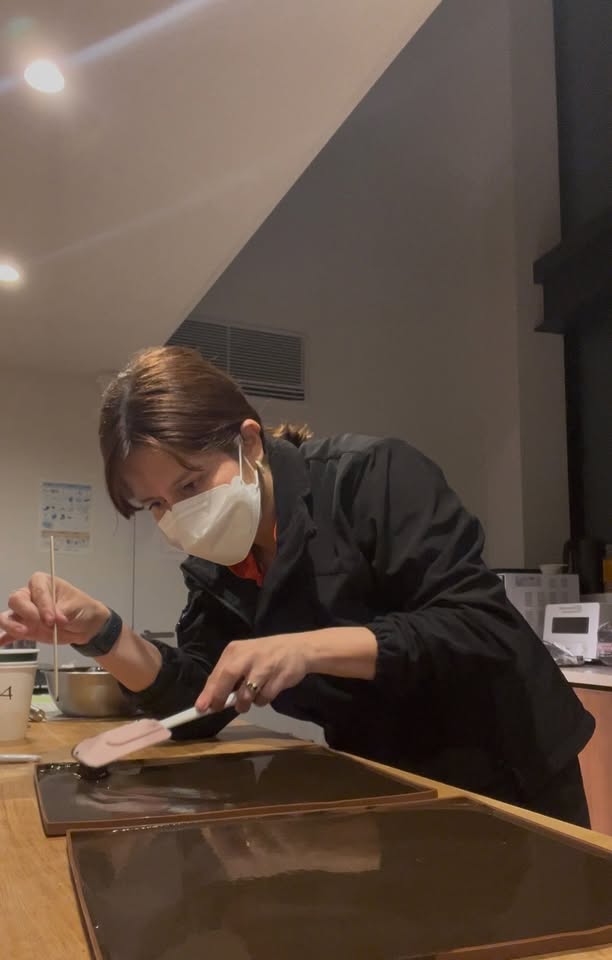 Coating coffee leather mixture onto a board in the lab